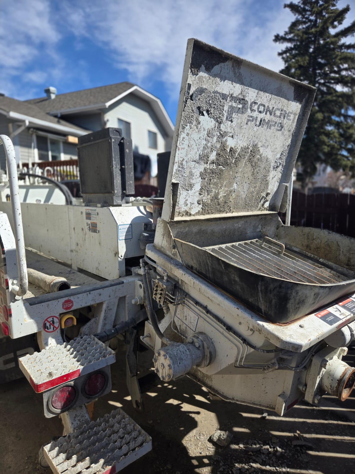 YB General Services concrete pump on a Calgary jobsite