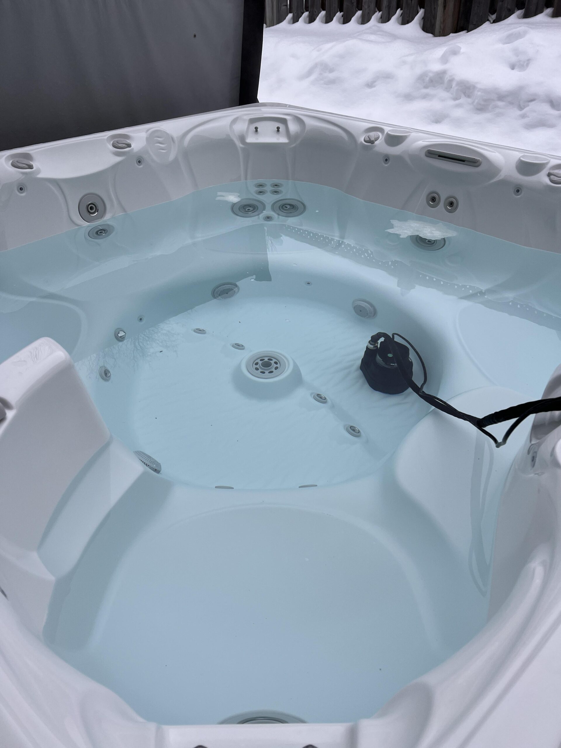 Scheduled hot tub drain and refill