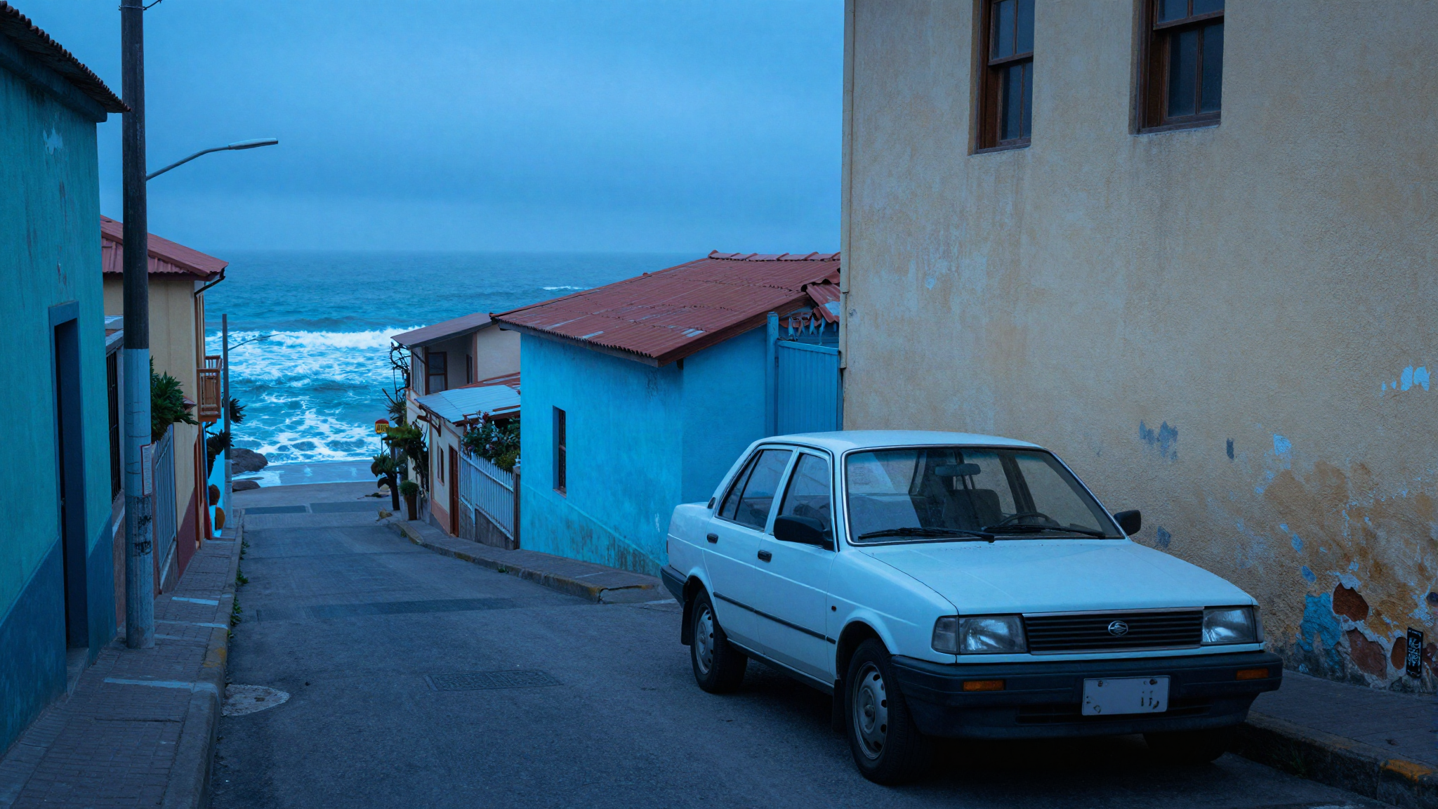 A vintage shared taxi on a steep street in a Chilean coastal town