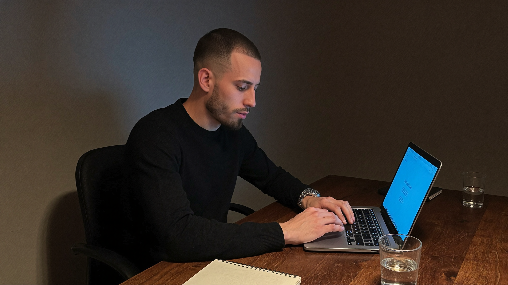 Cody Wise working at his desk at night