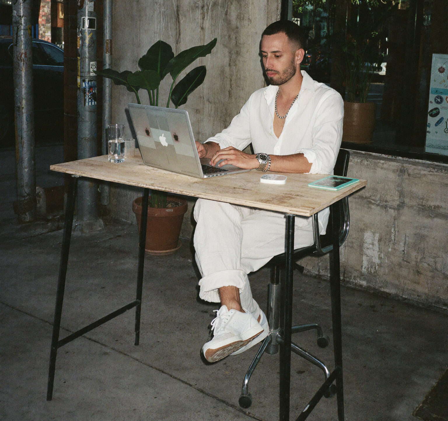 Cody Wise working from a street cafe