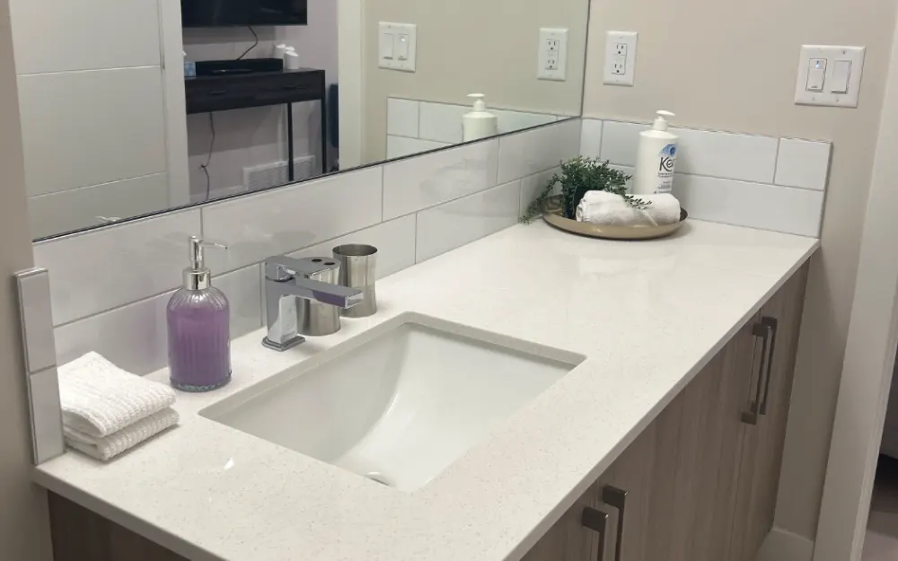 Bathroom vanity wiped down and restocked after a CleanStays turnover