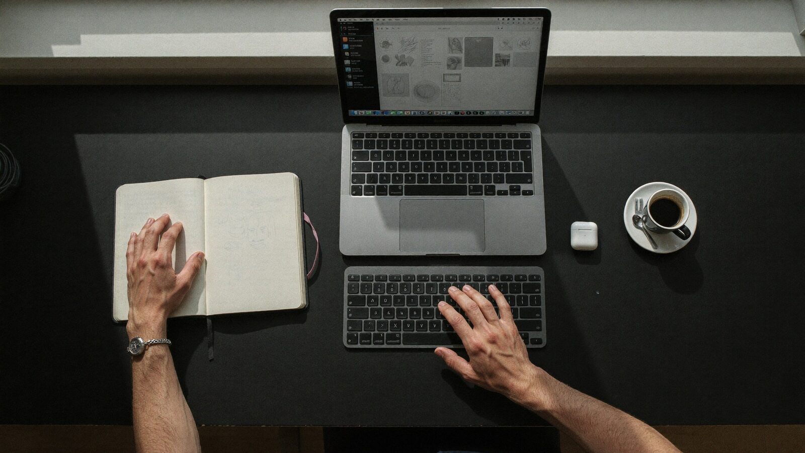 Cody Wise sketching interface ideas at his desk, designing RWA product flows that keep the chain out of sight