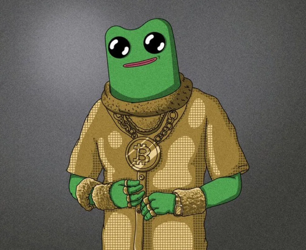 The Fwog character in a gold fur trimmed coat wearing a chain with a Bitcoin pendant, against a grey background