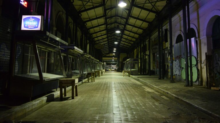 Empty market hall at night, the state of most tokenized real-world assets: a venue with no buyers in it