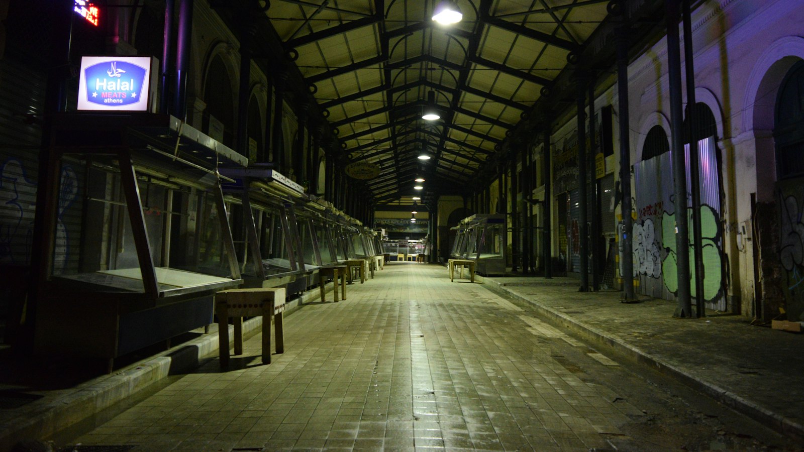 Empty market hall at night, the state of most tokenized real-world assets: a venue with no buyers in it