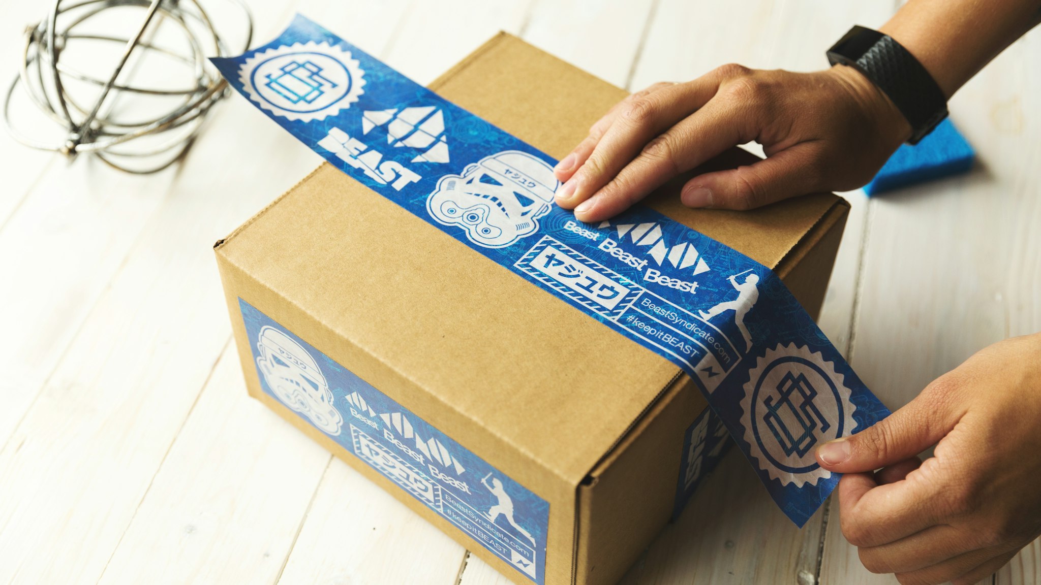 Hands passing a parcel back across a counter