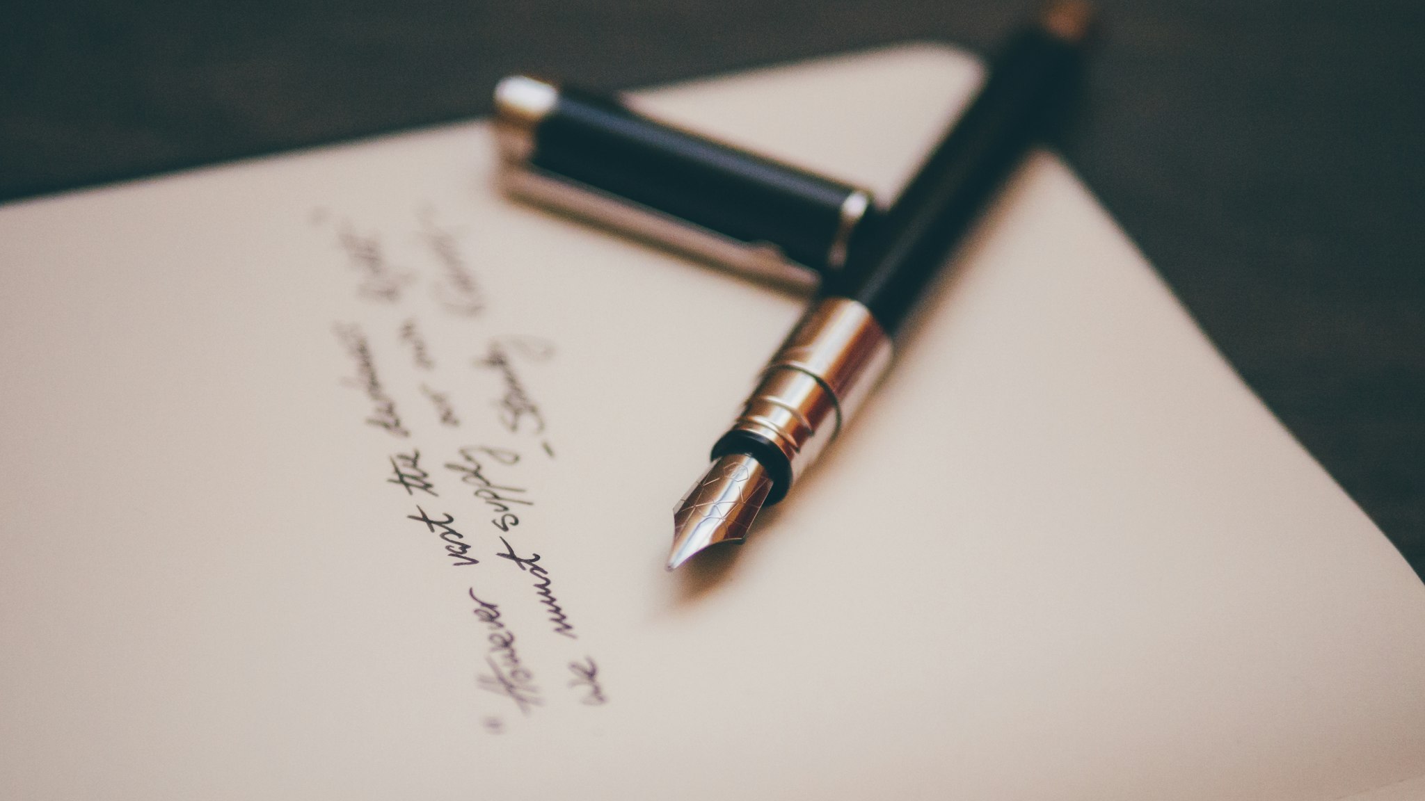 A single page document and a pen on a clean desk