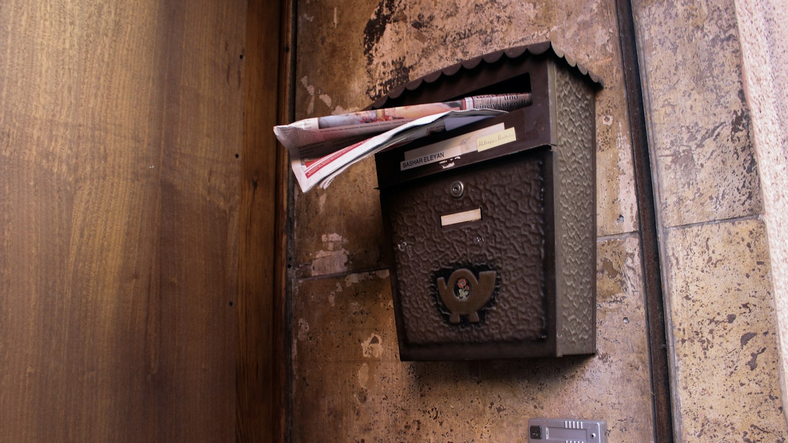 A wall mailbox stuffed with paper: an inbox is a list of other people's priorities, delivered in the order they arrived