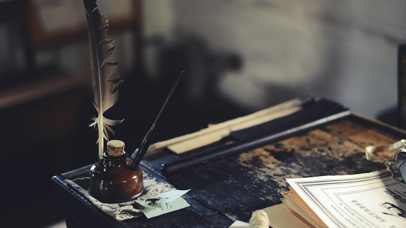 Quill and ink bottle on a desk, the tools of the secretary Machiavelli said reveals the quality of the person who hired them