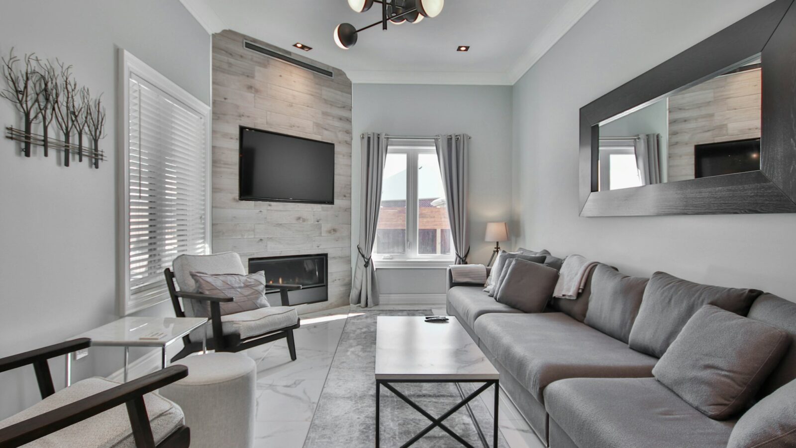 Open plan living room of a short term rental ready for guests