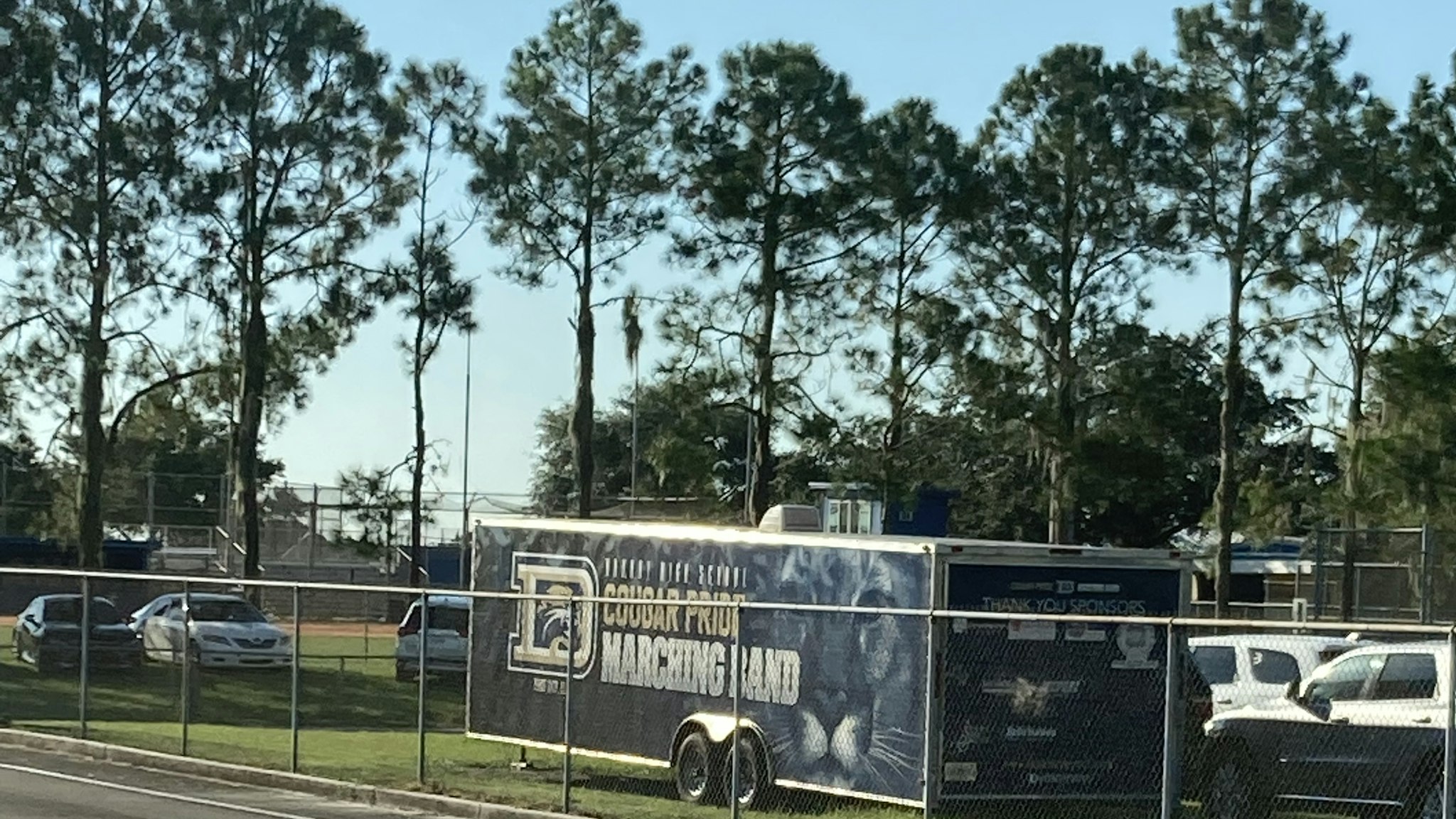 Work truck parked beside a fenced lot, the crew stay nobody writes a page for